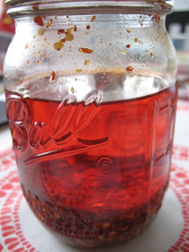 After a few days the oil will clear and be a beautiful ruby red